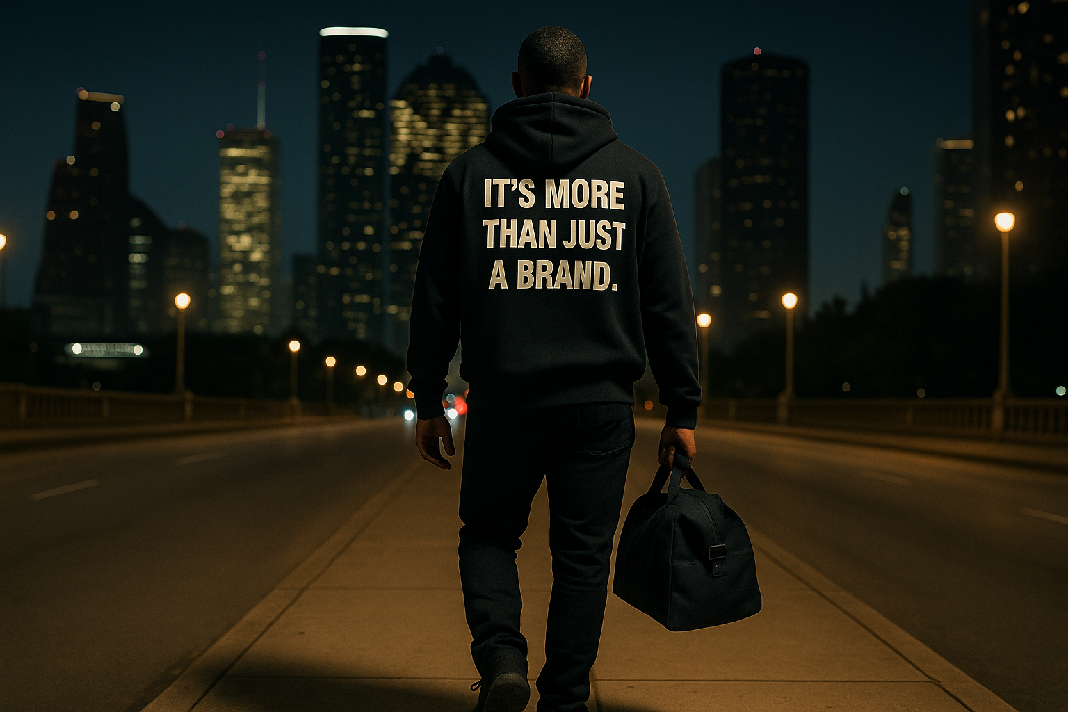 Person walking on a bridge with a dark hoodie and text, city skyline in the background